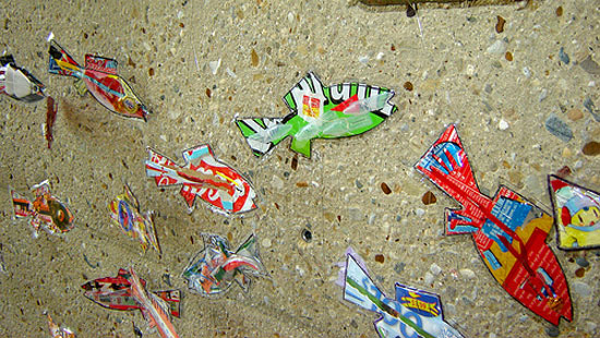 Mosaic of fish on a wall, made from recycled waste
