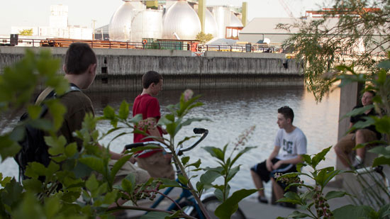 Kids talking next to a canal