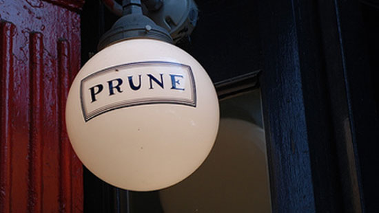 A streetlamp with the Prune logo on it