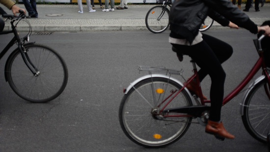 Cyclists riding down a street