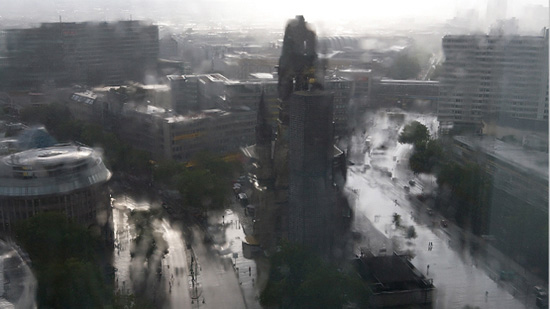 Blurry photograph of a rain-drenched public square