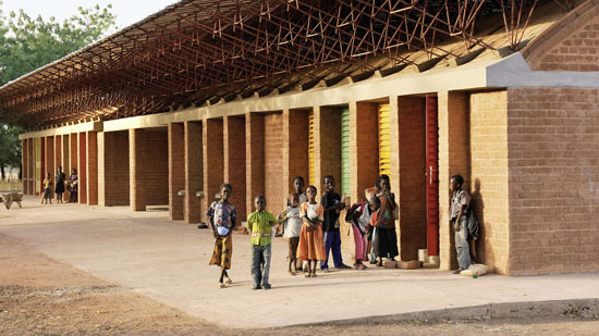 Photograph of people milling about on a long patio