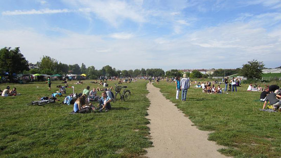People sitting in a park on a sunny day